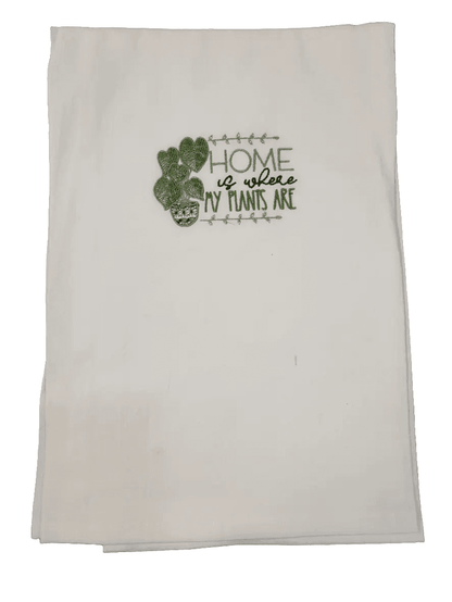 Folded embroidered plant towel with heart-shaped leaves and home quote. Perfect small gift for gardening fans and kitchen decor accents.