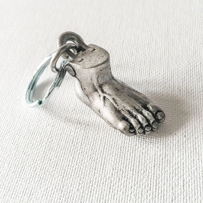 Human Foot Keychain with anatomical design, featuring realistic toes and compact metal form. Ideal small gift for anatomy lovers.