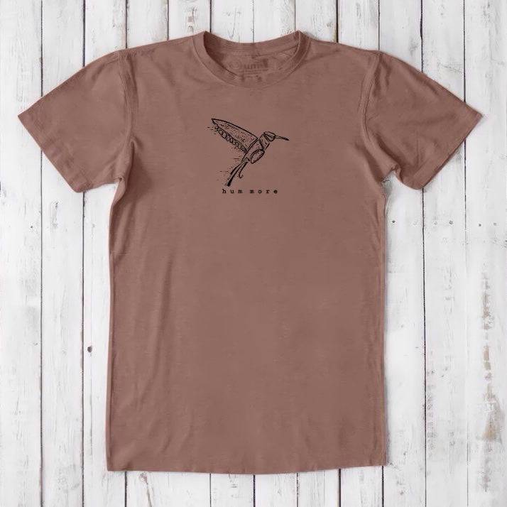 Men's Hummingbird T-Shirt in Bamboo & Organic Cotton, dusty rose with black bird sketch and 'hum more' text, sustainable casual wear.