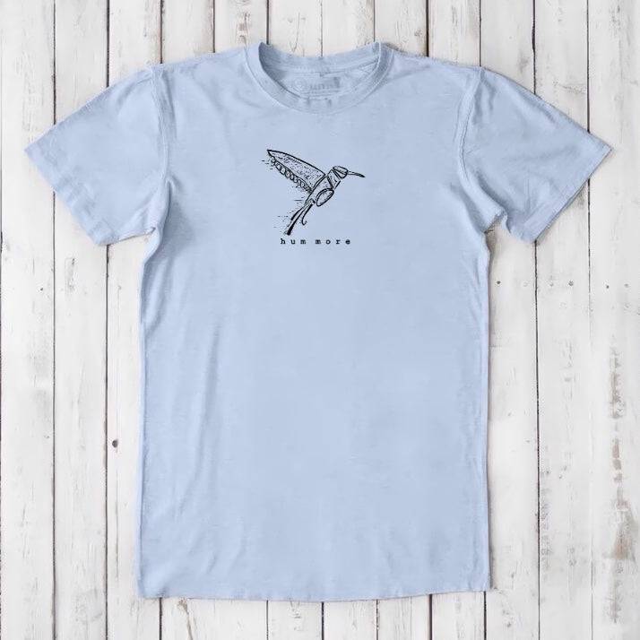 Men's Hummingbird T-Shirt in Bamboo & Organic Cotton, sky blue with black bird illustration and 'hum more' text, sustainable nature tee.