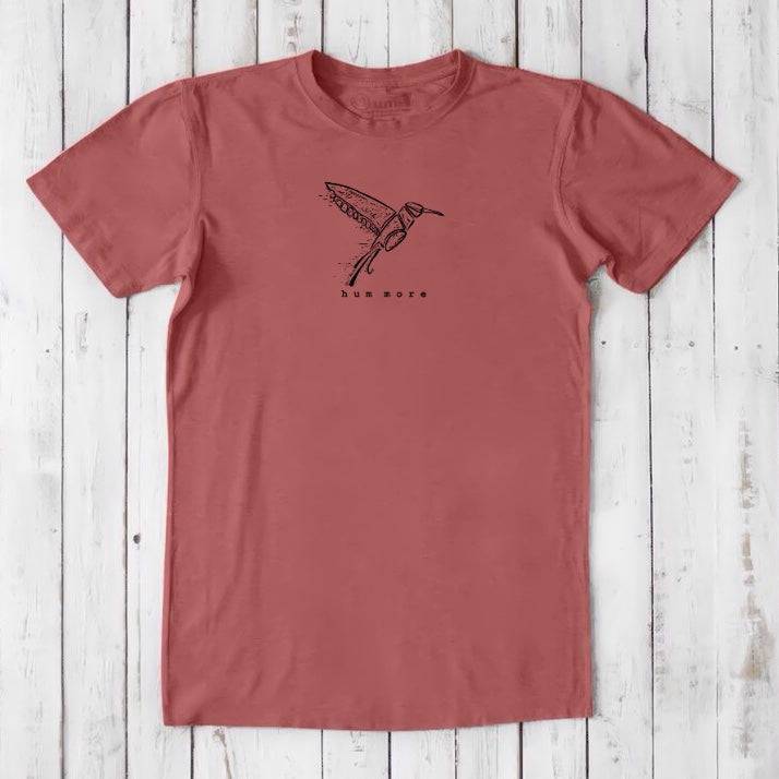 Men's Hummingbird T-Shirt in Bamboo & Organic Cotton, red clay color with black hummingbird print and 'hum more' phrase, eco-conscious tee.
