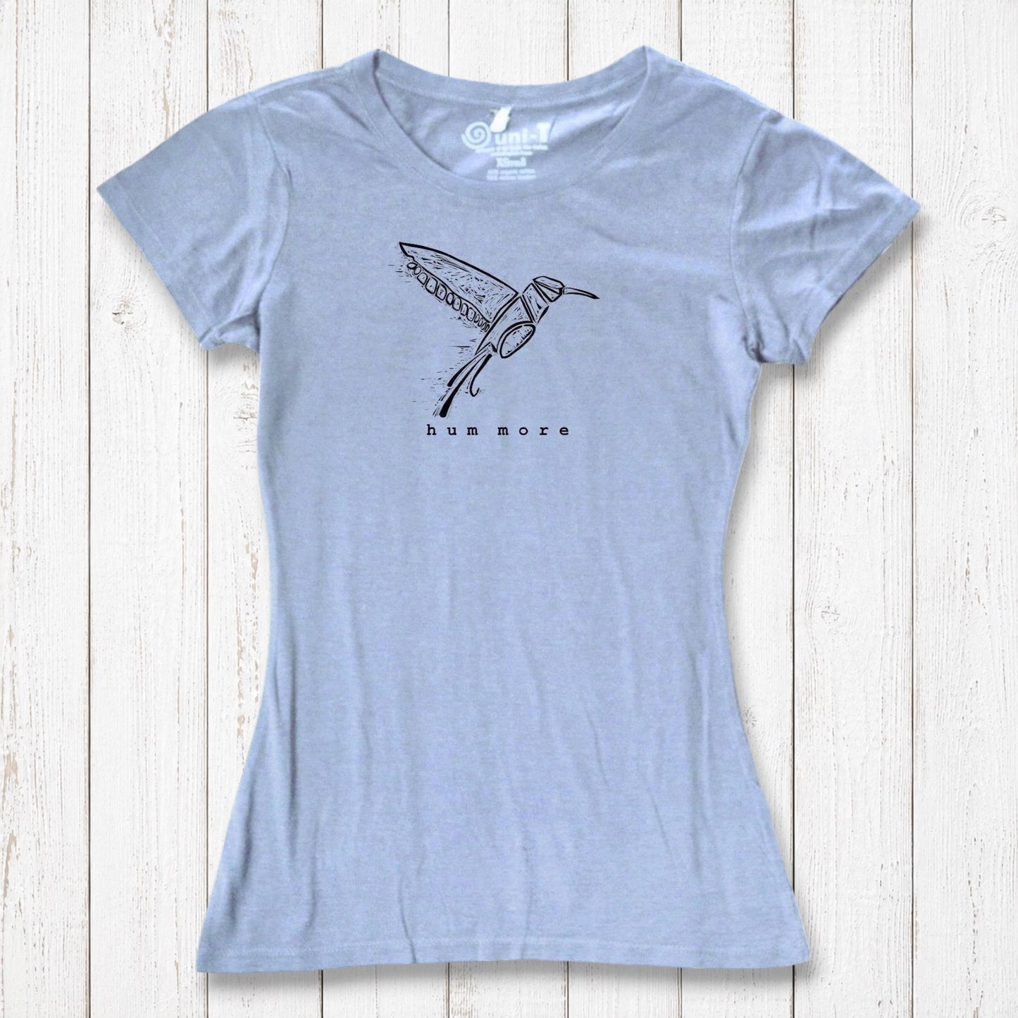 Light blue Hum More Women's Bamboo Hummingbird Shirt with artistic bird design, combining comfort and sustainability in a soft tee.