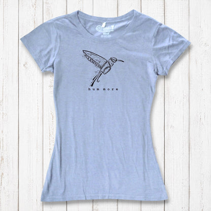 Light blue Hum More Women's Bamboo Hummingbird Shirt with artistic bird design, combining comfort and sustainability in a soft tee.