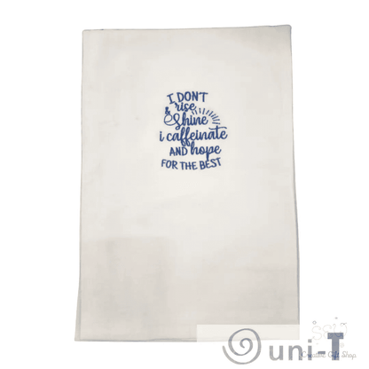 Blue embroidered towel with humorous coffee quote, great for home décor or gifting in the kitchen towels category for coffee fans.