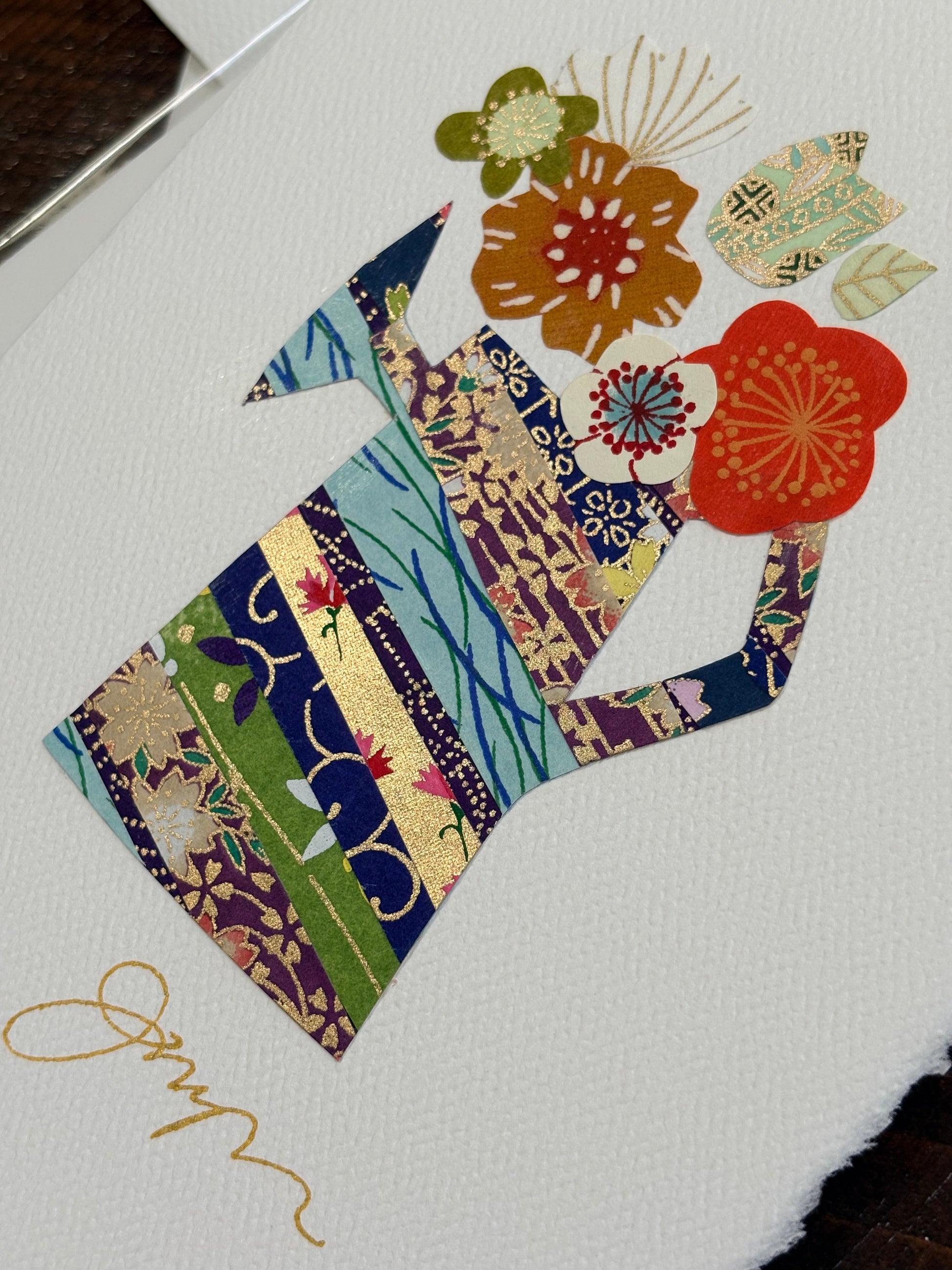 Handmade collage greeting card with floral design and colorful paper cutouts