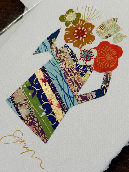 Handmade collage greeting card with floral design and colorful paper cutouts