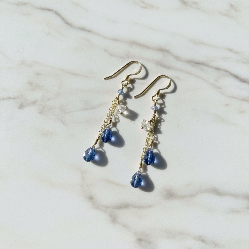Gold chain drop earrings with blue and clear gemstones