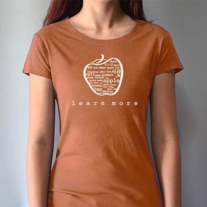 Rust orange women's bamboo & organic cotton T-shirt with apple 'learn more' graphic, inspirational gift for educators and mentors.