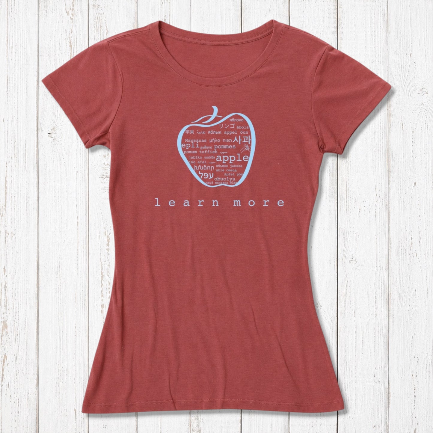 Red women's fitted T-shirt with apple 'learn more' graphic, crafted from bamboo & organic cotton, ideal for teacher appreciation.