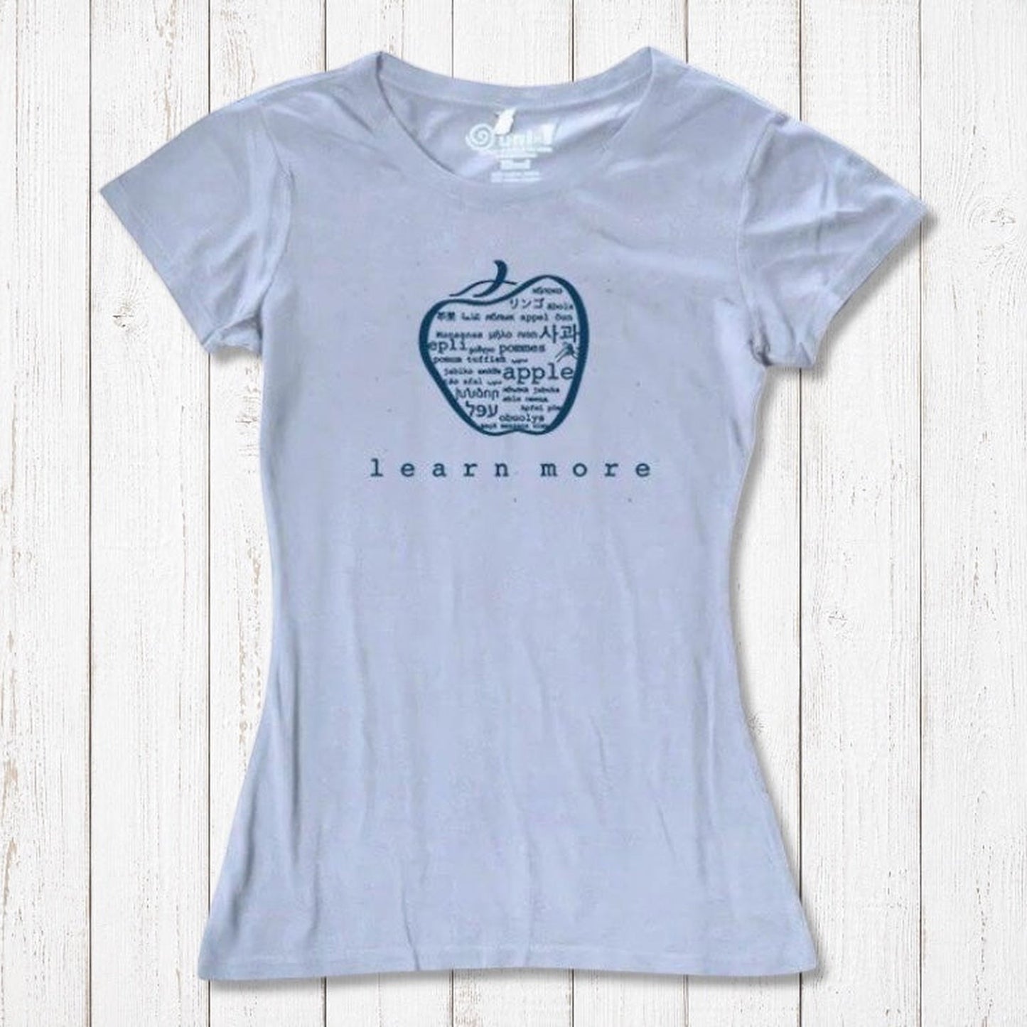 Light blue women's T-shirt made from bamboo & organic cotton, featuring apple 'learn more' graphic, perfect for teacher gifts.