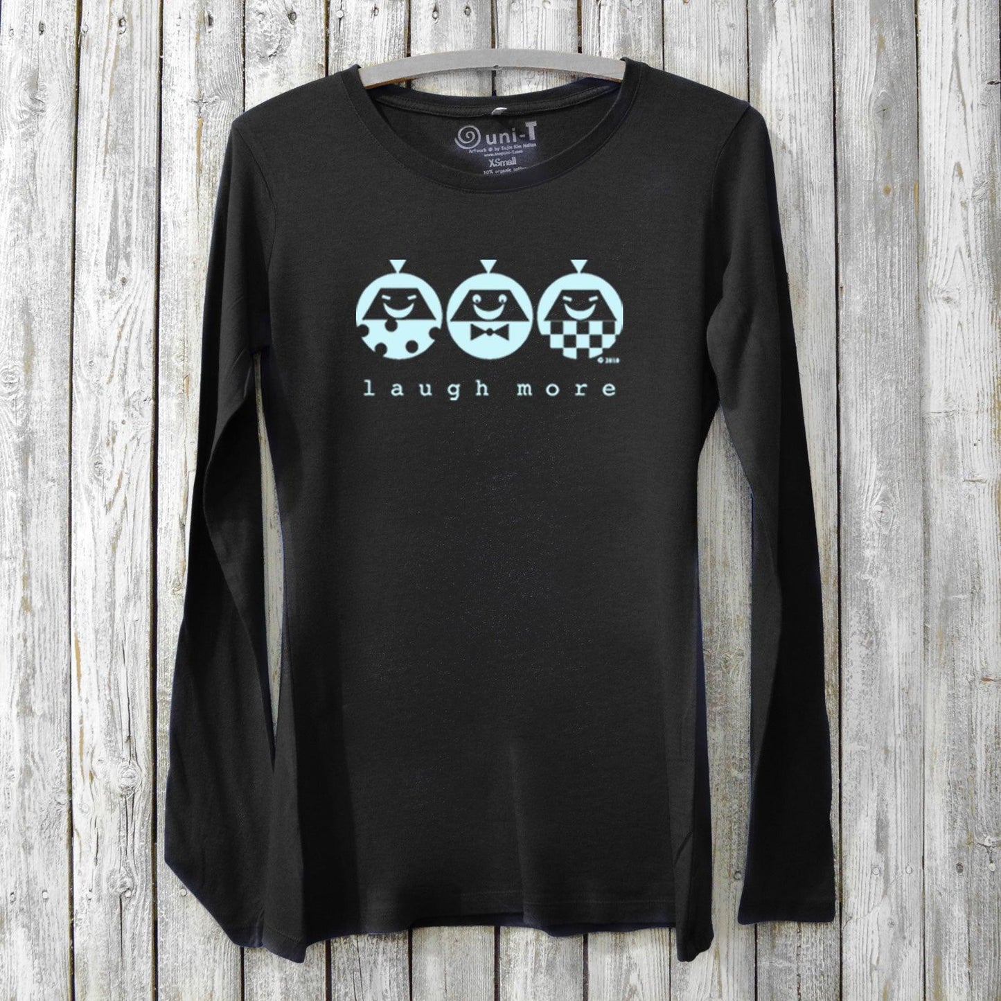 Black bamboo & organic cotton women's long sleeve tee featuring 'Laugh More' quote and playful blue character print, cozy positive vibe shirt by Uni-T.
