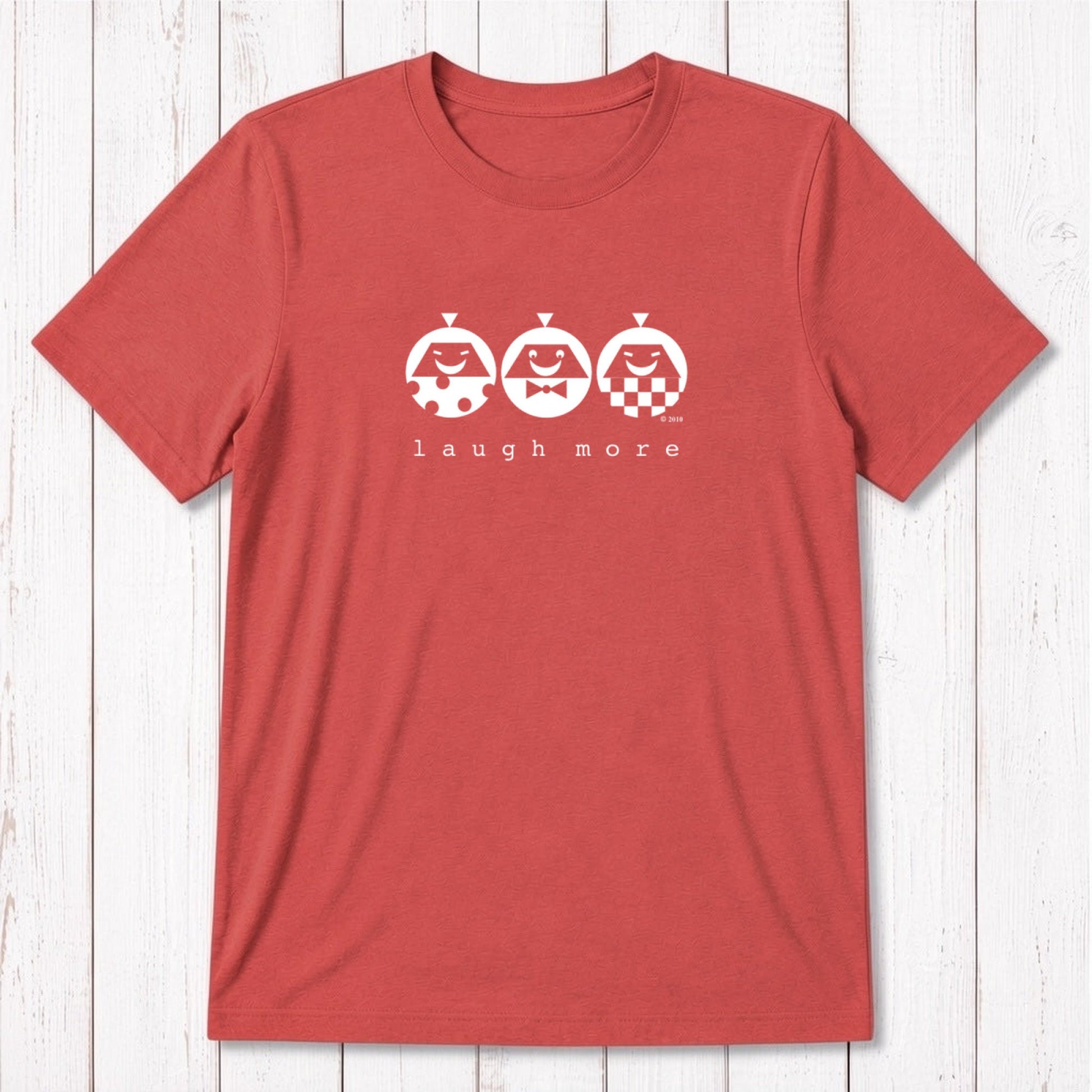 Men's Happy T-Shirt in Bamboo & Organic Cotton in coral red with mint 'Laugh More' cartoon design. Positive vibe gift for men.