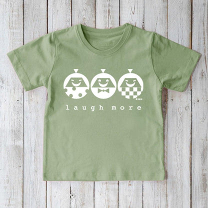Light green Kids' Happy Vibe Organic Cotton T-Shirt with white 'Laugh More' print. Eco-friendly and cheerful top for kids by Uni-T.