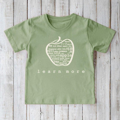 Green Kids' Apple Organic Cotton T-Shirt with light apple graphic and 'learn more' message. Educational and sustainable shirt by Uni-T.