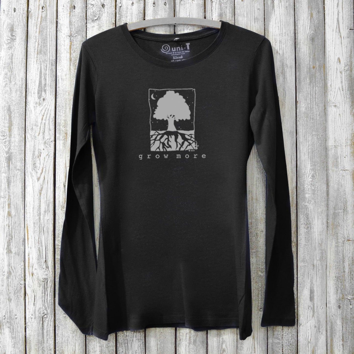 Black sustainable women's long sleeve T-shirt with nature-inspired 'Grow More' tree print, ideal gift for plant lovers and gardening enthusiasts.