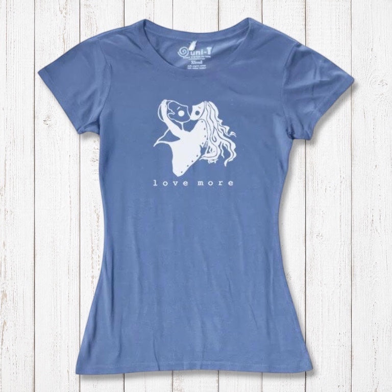 Sky blue bamboo & organic cotton Love More T-Shirt for women with white heart graphic. Sustainable and romantic fashion statement.