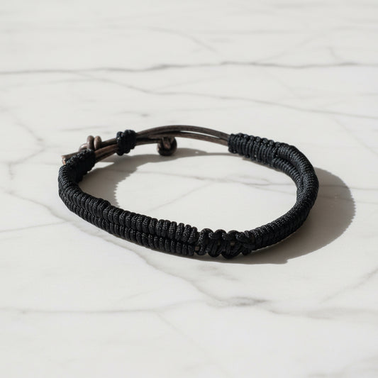 Black leather bracelet with adjustable cord