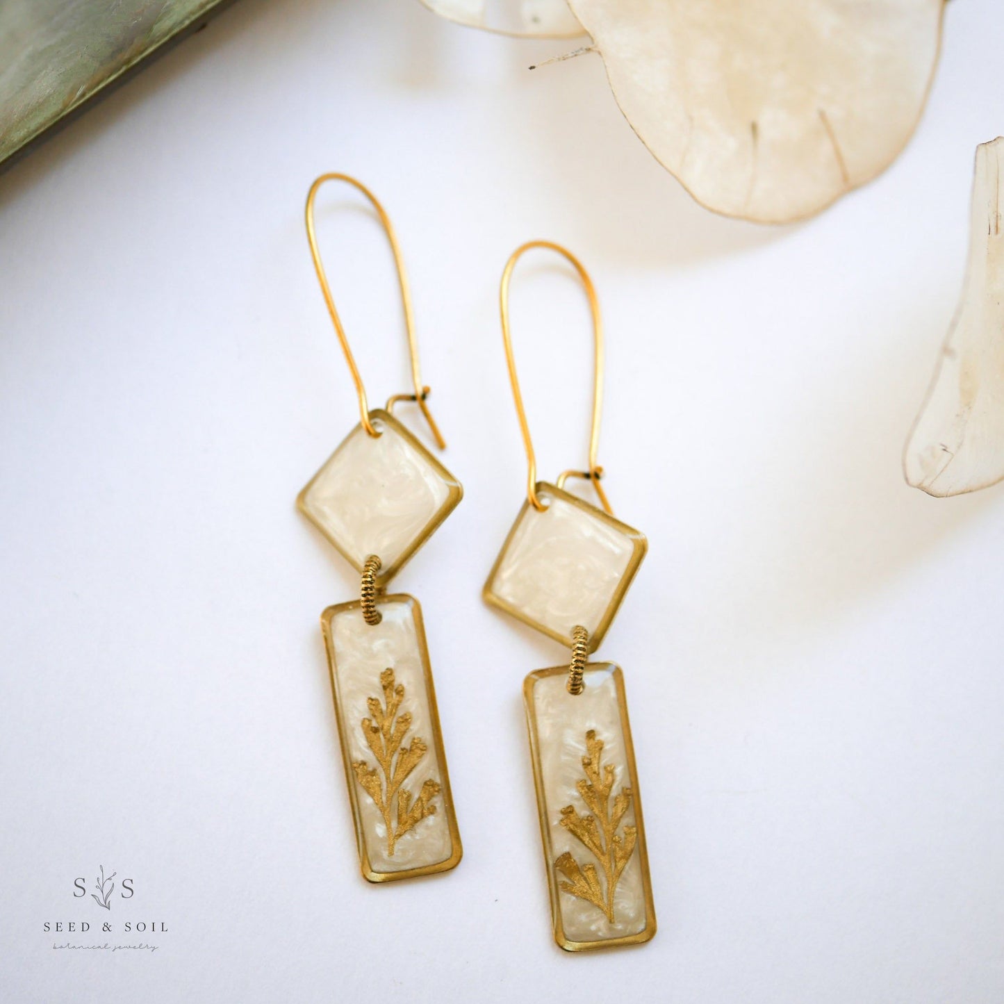 Midas Deco Earrings - Art Dangle in brass with 24k gold plate, featuring opalescent diamond and rectangle shapes with fern detail.