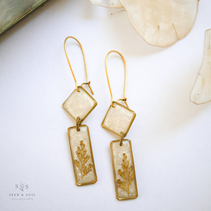 Midas Deco Earrings - Art Dangle in brass with 24k gold plate, featuring opalescent diamond and rectangle shapes with fern detail.