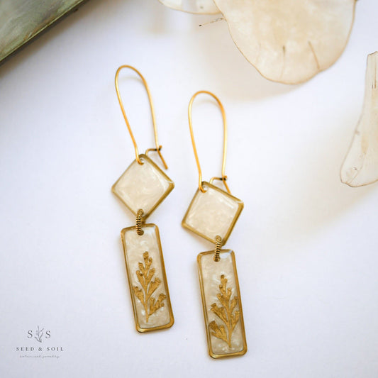 Midas Deco Earrings - Art Dangle in brass with 24k gold plate, featuring opalescent diamond and rectangle shapes with fern detail.