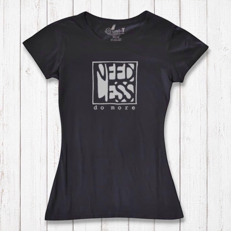 Black women's bamboo and organic cotton t-shirt with 'Need Less Do More' graphic. Sustainable inspirational gift for minimalist lifestyle.