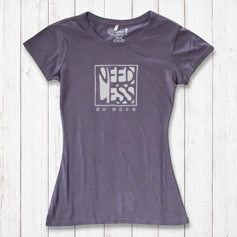 Charcoal grey women's organic cotton and bamboo tee with 'Need Less Do More' quote. Eco-friendly minimalist fashion top.