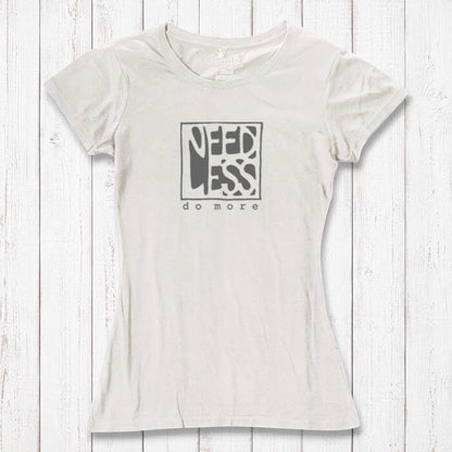 Ivory white women's bamboo and organic cotton t-shirt with 'Need Less Do More' quote. Minimalist and eco-conscious fashion top.