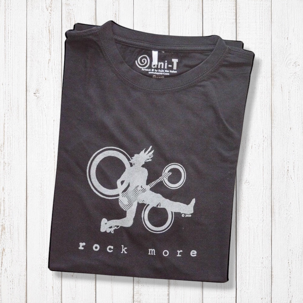 'Rock More' men's guitar T-shirt in folded black bamboo cotton, with silver rock and roll graphic, ideal gift for musicians.