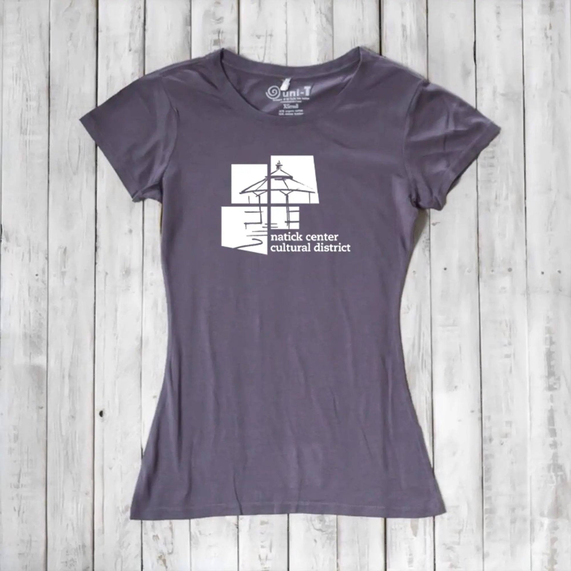 Slate purple Women's Bamboo Natick Center T-Shirt with white cultural district logo. Eco-conscious bamboo and organic cotton blend.