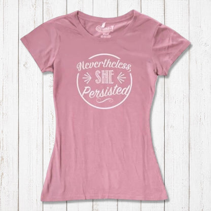 Light pink 'Nevertheless She Persisted' tee for women with white text. Organic cotton and bamboo blend top promoting equality and resilience.