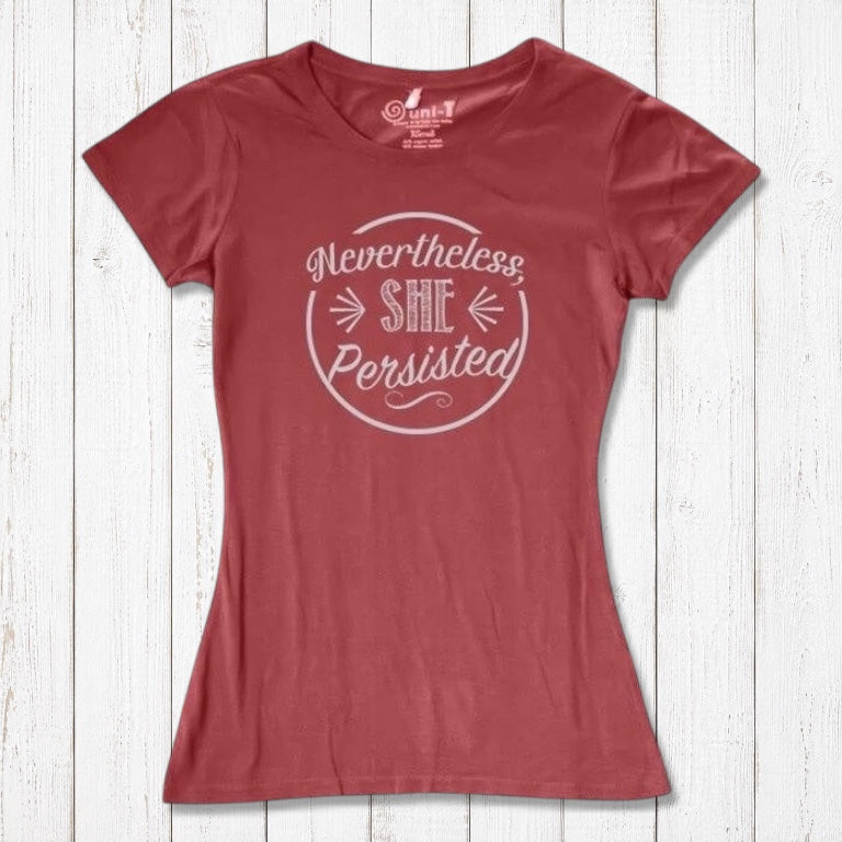 Coral red 'Nevertheless She Persisted' women's tee with white text. Eco-friendly bamboo and organic cotton feminist shirt by Uni-T.
