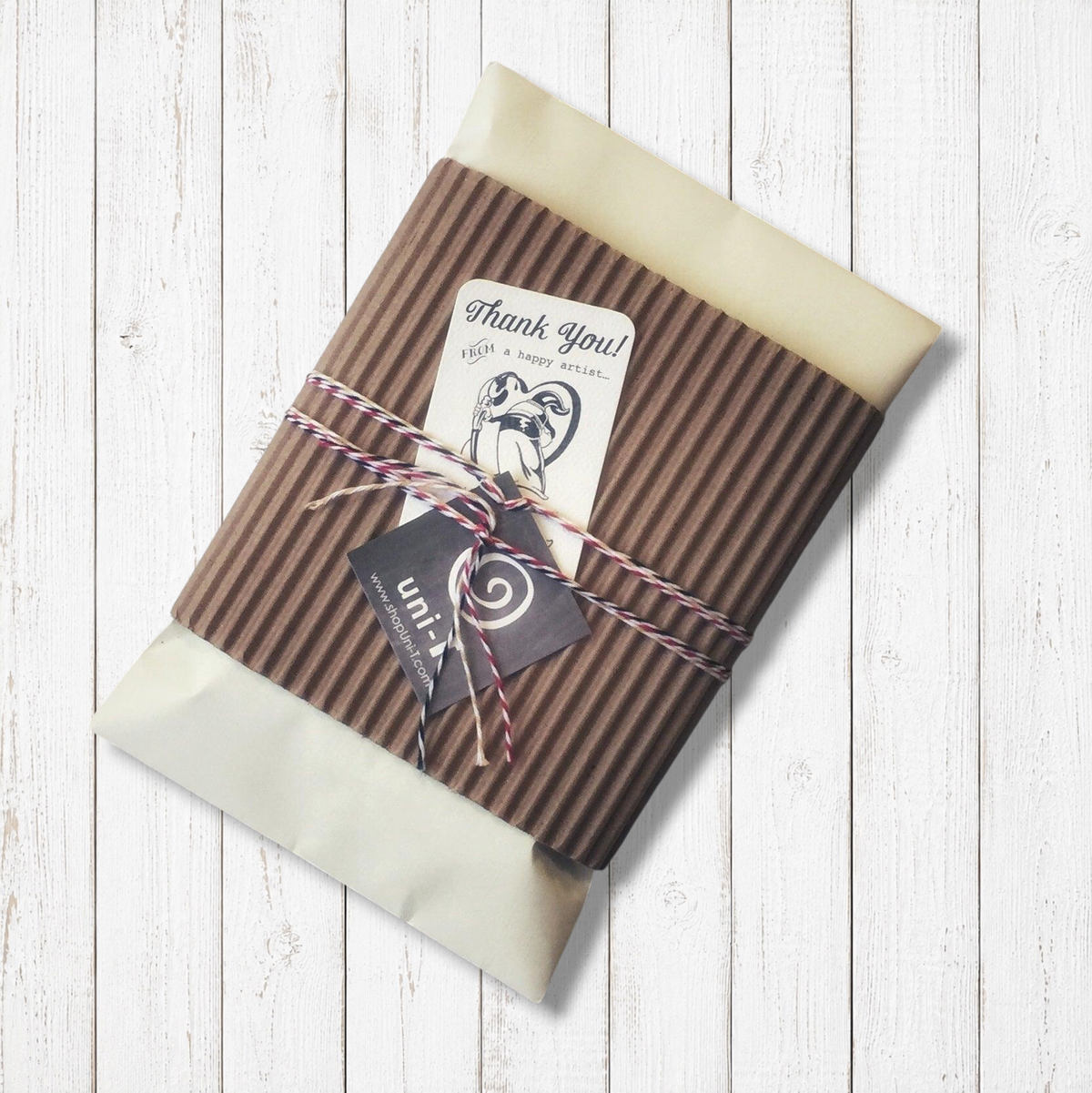 Eco-friendly gift packaging for Ninja Long Sleeve T-shirts for Men, wrapped in kraft paper with twine and thank-you tag, perfect for sustainable gifting.