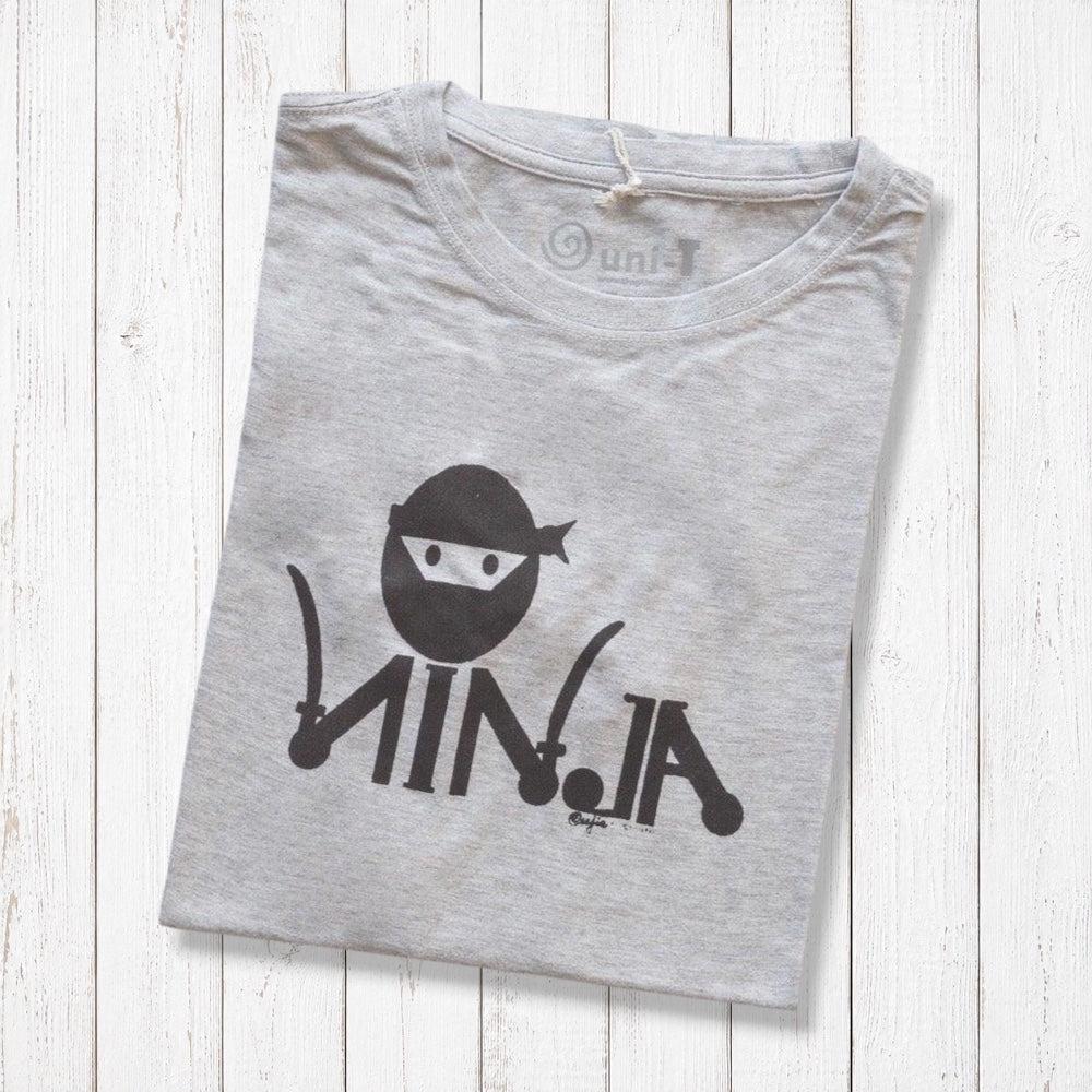 Men's Ninja T-Shirt in Bamboo & Organic Cotton folded on white wood, featuring black 'Stealth Mode' ninja graphic in classic fit.