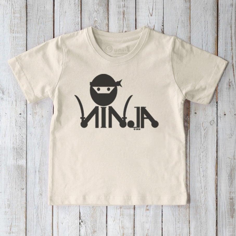Cream Kids' Ninja Organic Cotton T-Shirt featuring bold black ninja print, sustainable and fun graphic tee for active children by Uni-T.