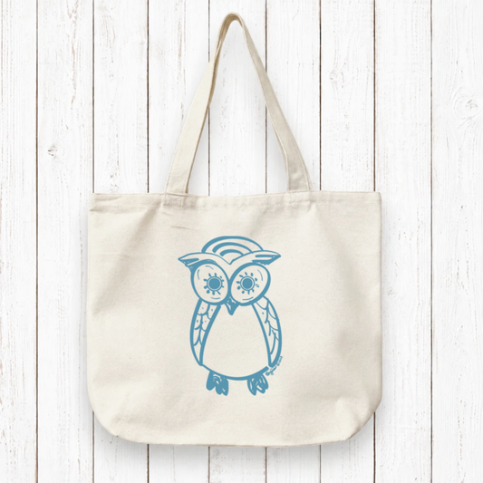Owl Lovers Organic Tote Bag in natural canvas with blue hand-drawn owl design, eco-friendly and handcrafted for sustainable everyday use.