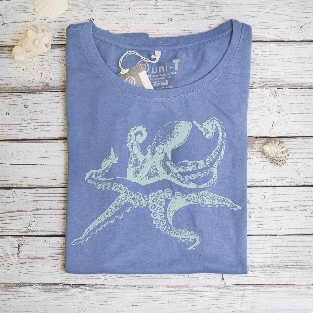 Folded blue Women’s Octopus T-Shirt in bamboo and organic cotton with sea creature graphic, sustainable ocean-themed gift idea.