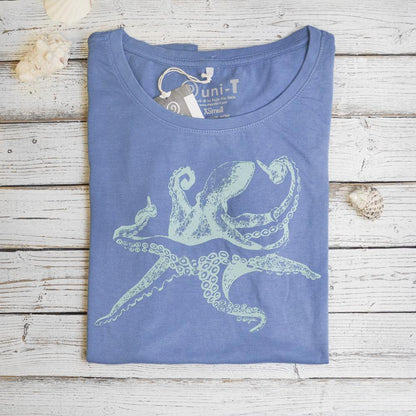 Folded blue Women’s Octopus T-Shirt in bamboo and organic cotton with sea creature graphic, sustainable ocean-themed gift idea.