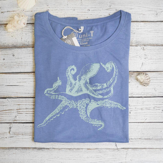 Folded blue Women’s Octopus T-Shirt in bamboo and organic cotton with sea creature graphic, sustainable ocean-themed gift idea.