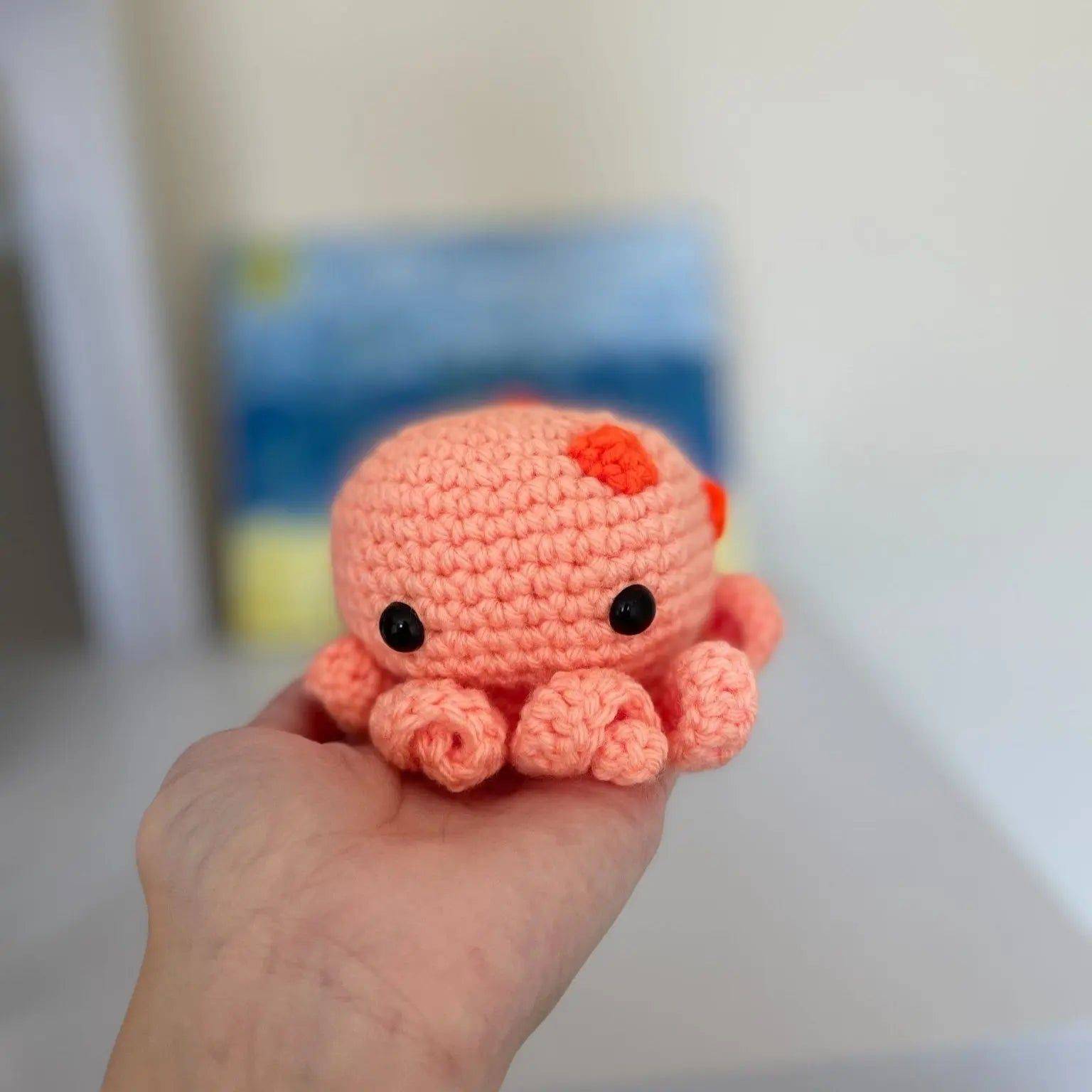 Ollie the Octopus Stress Ball - Stress Relief | Squeeze & Fidget small gift, handmade in soft peach yarn with black eyes and red accents. Ideal for fidgeting and stress relief.