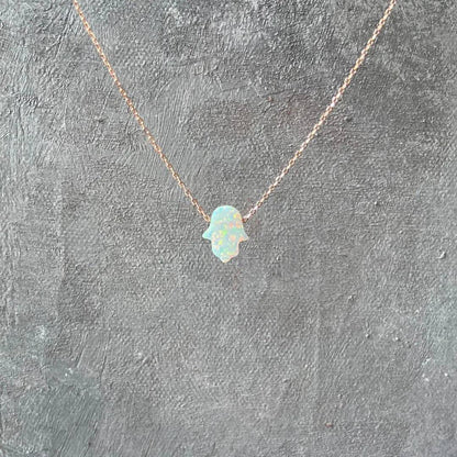 Opal Necklace - October Birthstone | Sterling Silver Charm featuring a Hamsa-shaped lab-created opal pendant on a delicate rose gold chain.