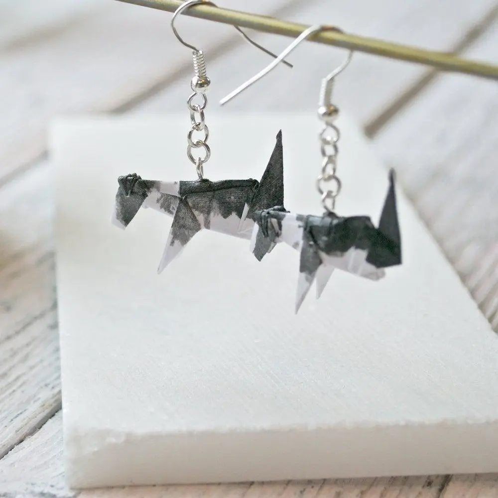 Unique Origami Dog Earrings - Stylish Origami Jewelry crafted from paper and acrylic, showcasing miniature black and white dogs on silver hooks.