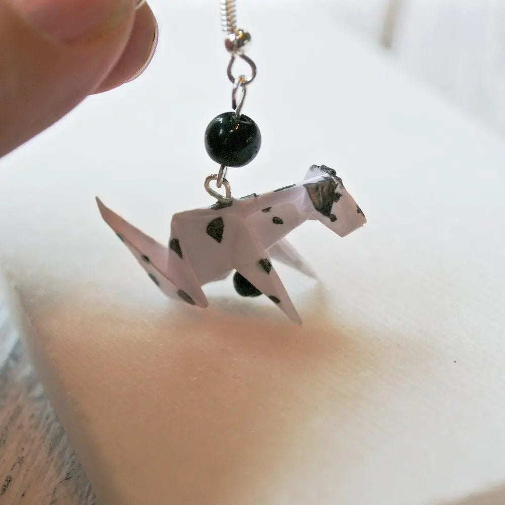 Dalmatian Origami Dog Earring featuring a folded paper dog with black spots and black bead accent, sealed with acrylic for durability.
