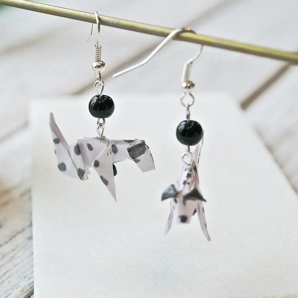 Pair of Dalmatian Origami Dog Earrings with black beads, showcasing intricate paper folding and spotted dog design for a playful accessory.