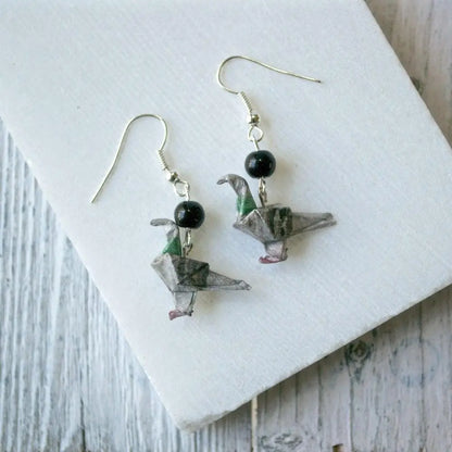 Origami Paper Dove Earrings in grey with black bead detail. Handcrafted and lightweight, ideal for adding artistic flair to any outfit.