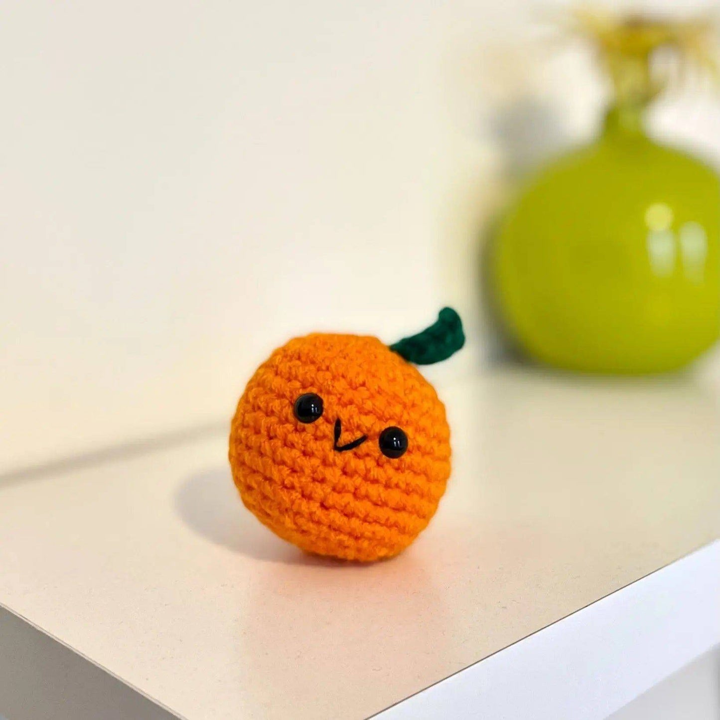 Otto the Orange Stress Ball - Crocheted Stress Ball with cute face and green stem, soft and portable for anxiety relief and small gift ideas.
