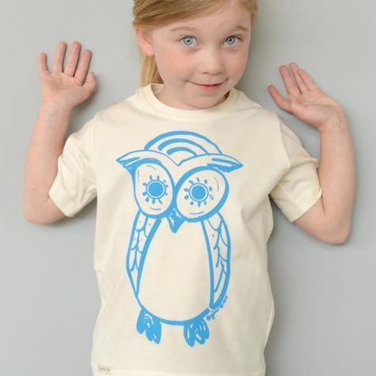 Kids' Cute Owl Organic Cotton T-Shirt in cream with blue owl graphic, worn by child. Eco-friendly nature top by Uni-T for young wildlife lovers.