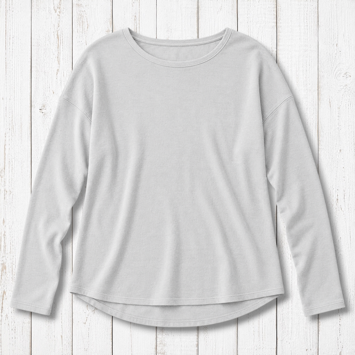 Uni-T vintage heavy knit pullover in light grey with dropped shoulders, long sleeves, and a curved high-low hem.