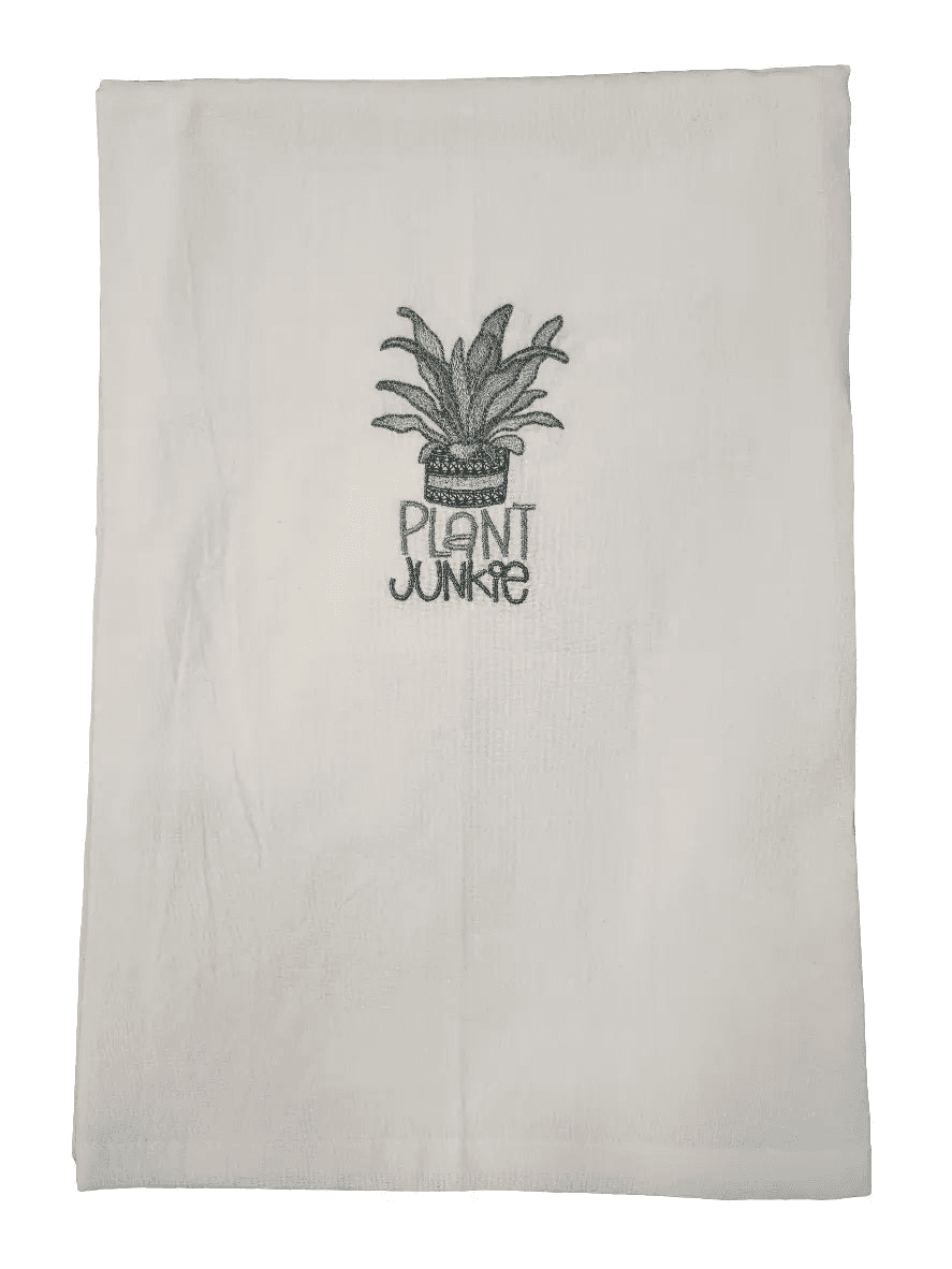 Close-up of Plant Junkie Embroidered Towel featuring potted plant and text. Ideal kitchen towel for plant lovers and humorous home décor.