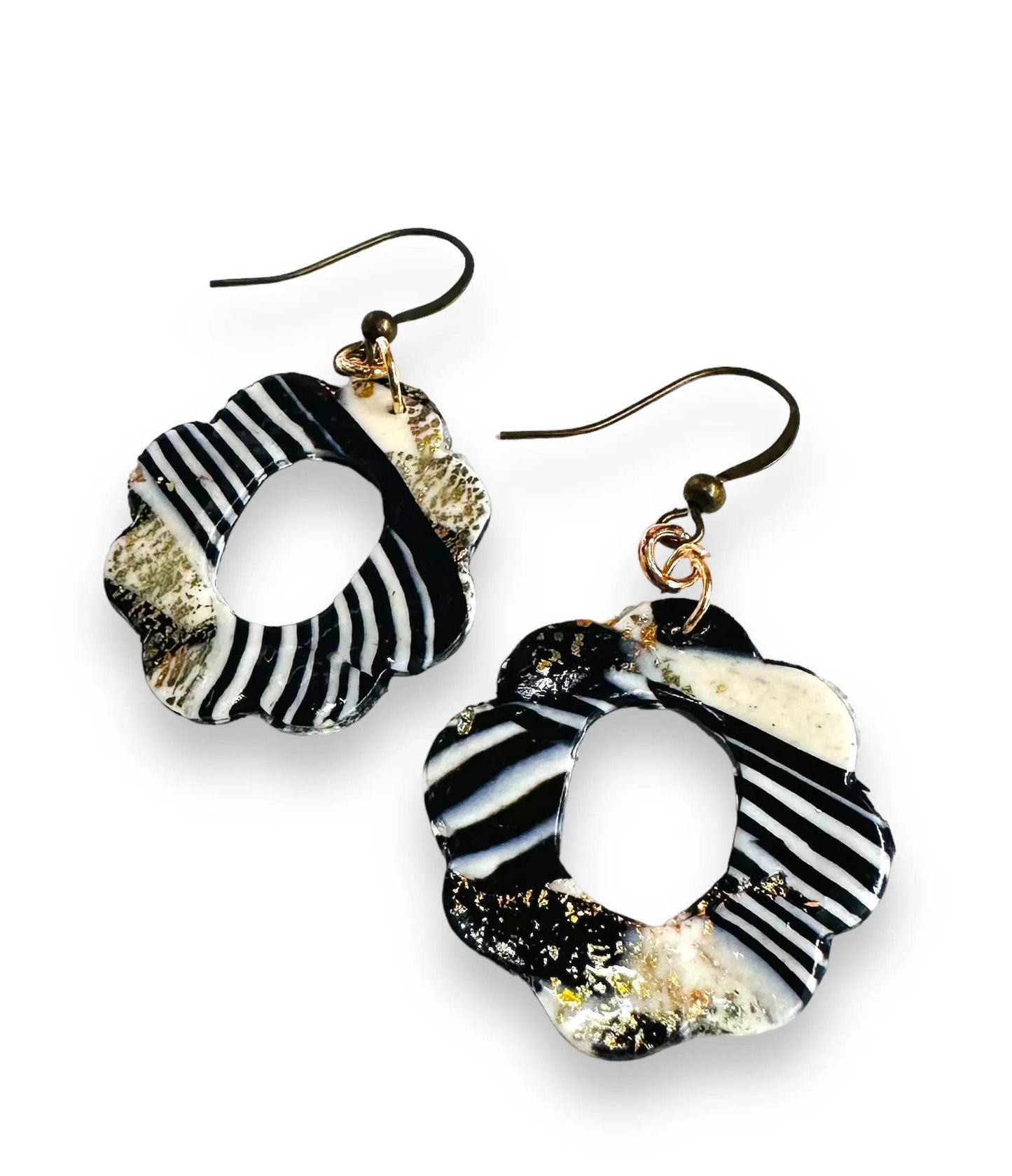 Black and white striped floral-shaped polymer clay earrings with gold accents, perfect for unique and affordable jewelry gifts.