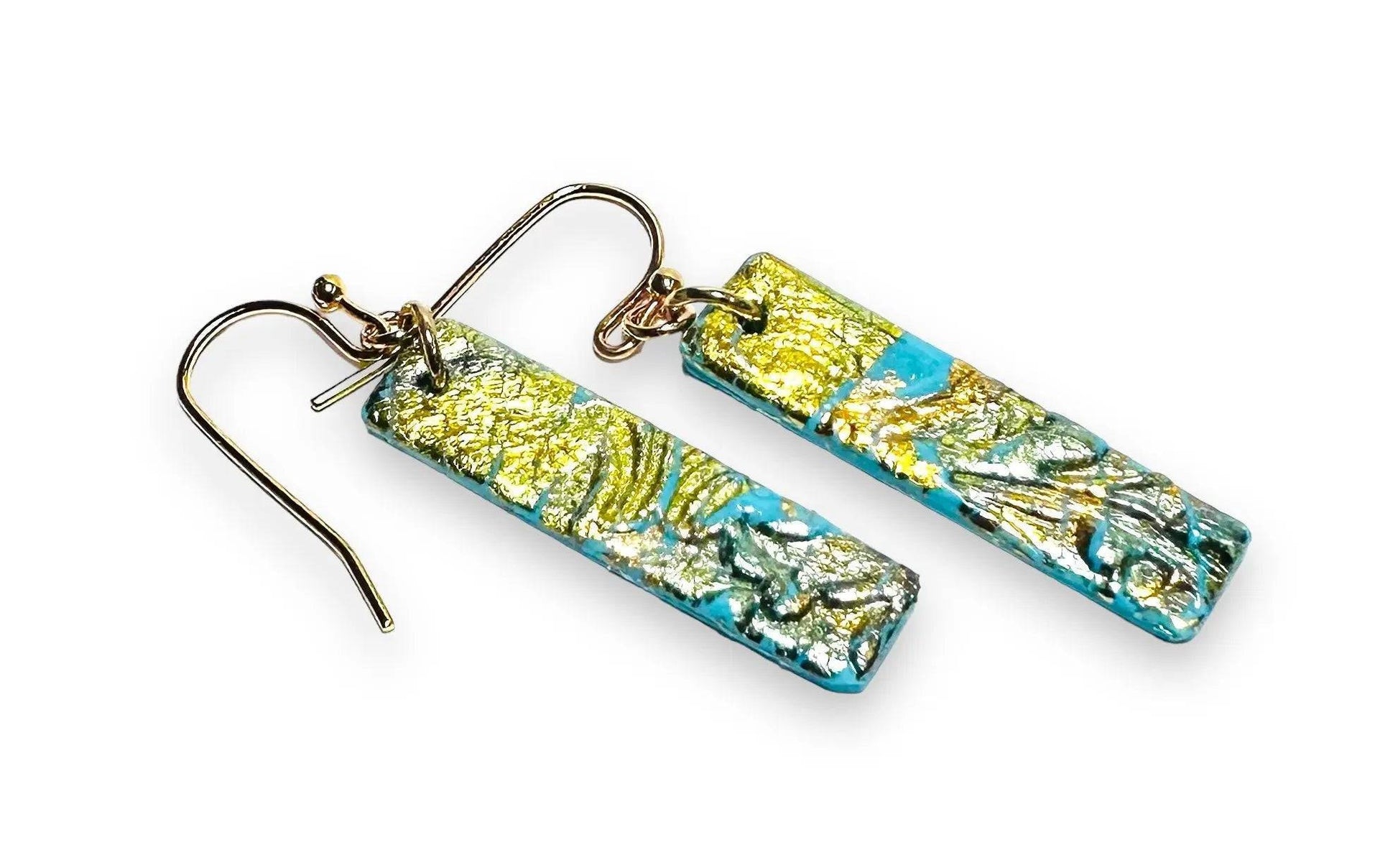 Rectangular turquoise polymer clay earrings with gold leaf marbling, a sleek and affordable accessory for gifting.